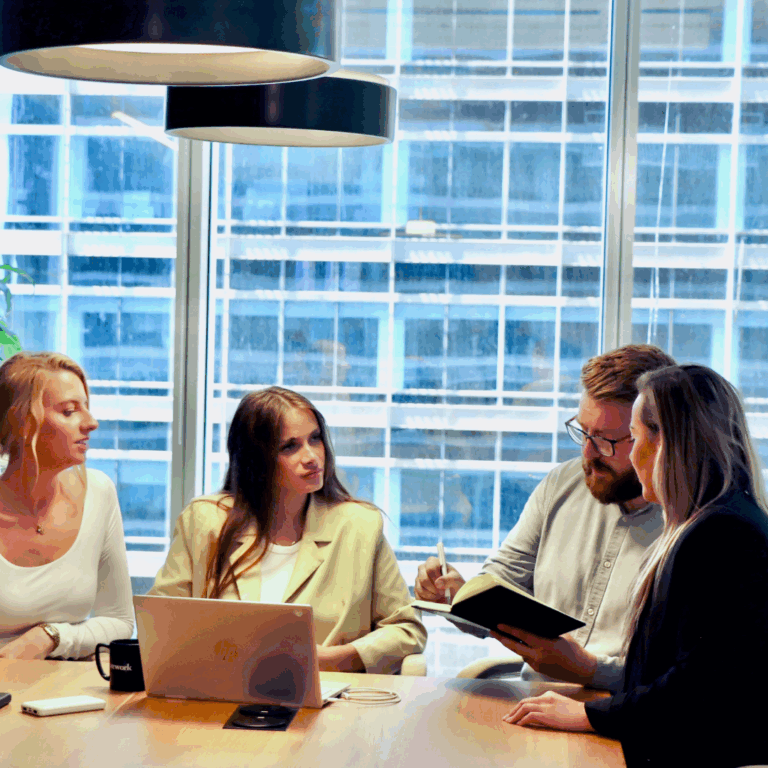 Artfully Media - Recruitment Advertising Made Simple Improve job advertising ROI without additional spend - People in an office meeting.